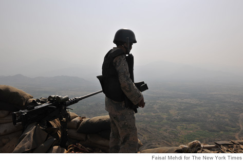 A Saudi border guard looks towards Yemen from his post near Jizan, Saudi Arabia. The remote 1,100-mile frontier of the Saudi-Yemebi border has become an emblem of the increasingly global threats emanating from Yemen: fighters from al-Qaida, Shiite insurgents, drugs and arms smuggling and one of the largest flows of economic refugees on earth. (Faisal Mehdi/The New York Times)